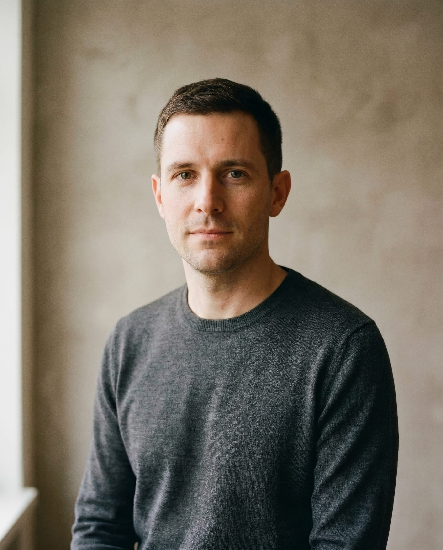 Lukas Brunner, Senior Associate at Switzerland Firma's Zurich office, formal head-and-shoulders portrait